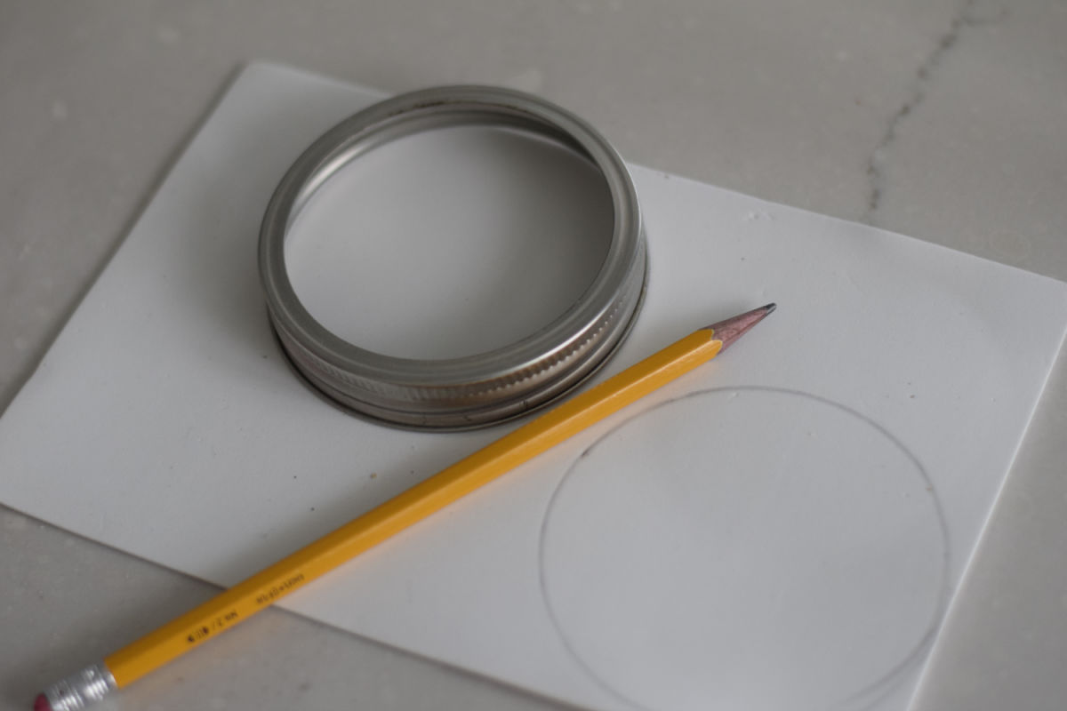 tracing circle on white foam sheet