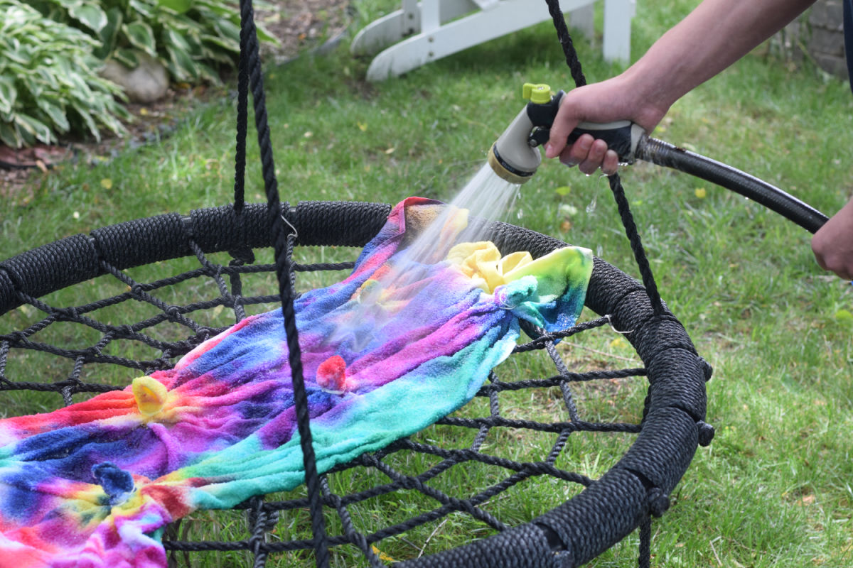 rinsing tie-dye beach towel