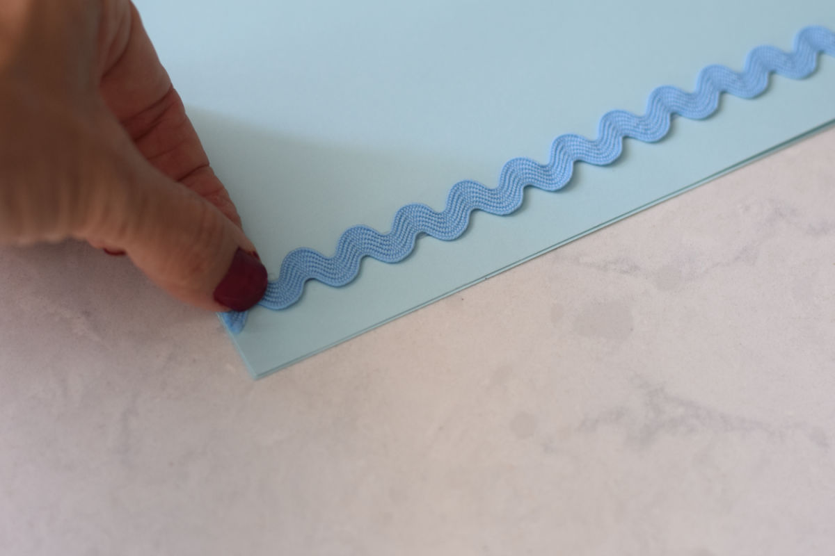 gluing rick-rack onto paper 