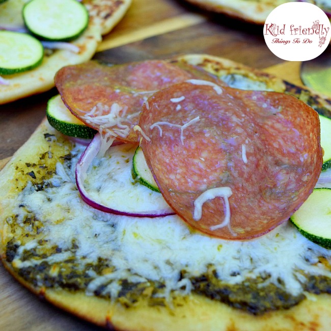 Grilled Pesto Zucchini and Salami Naan Bread Pizza Recipe - Delicious and so easy to make. Perfect for appetizers or a meal! www.kidfriendlythingstodo.com