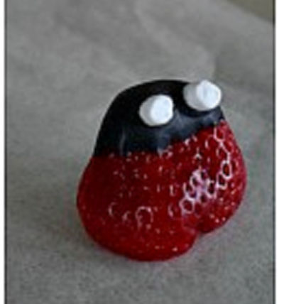 making ladybug strawberries