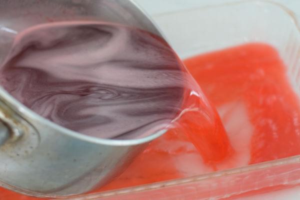 pouring jello into pans 