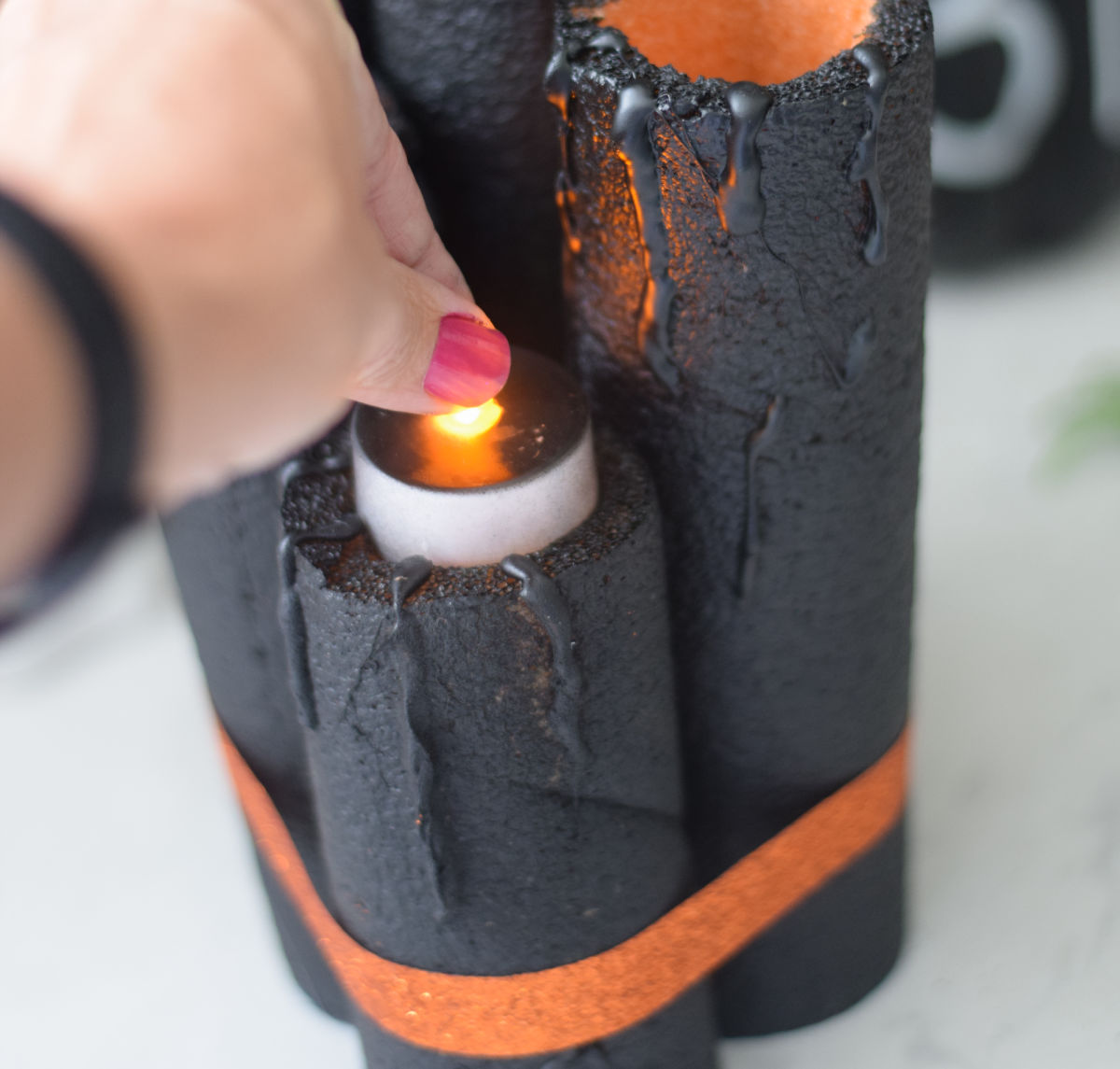 making Halloween pool noodle candles 