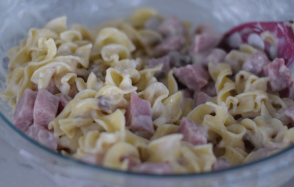 making ham and noodle casserole 