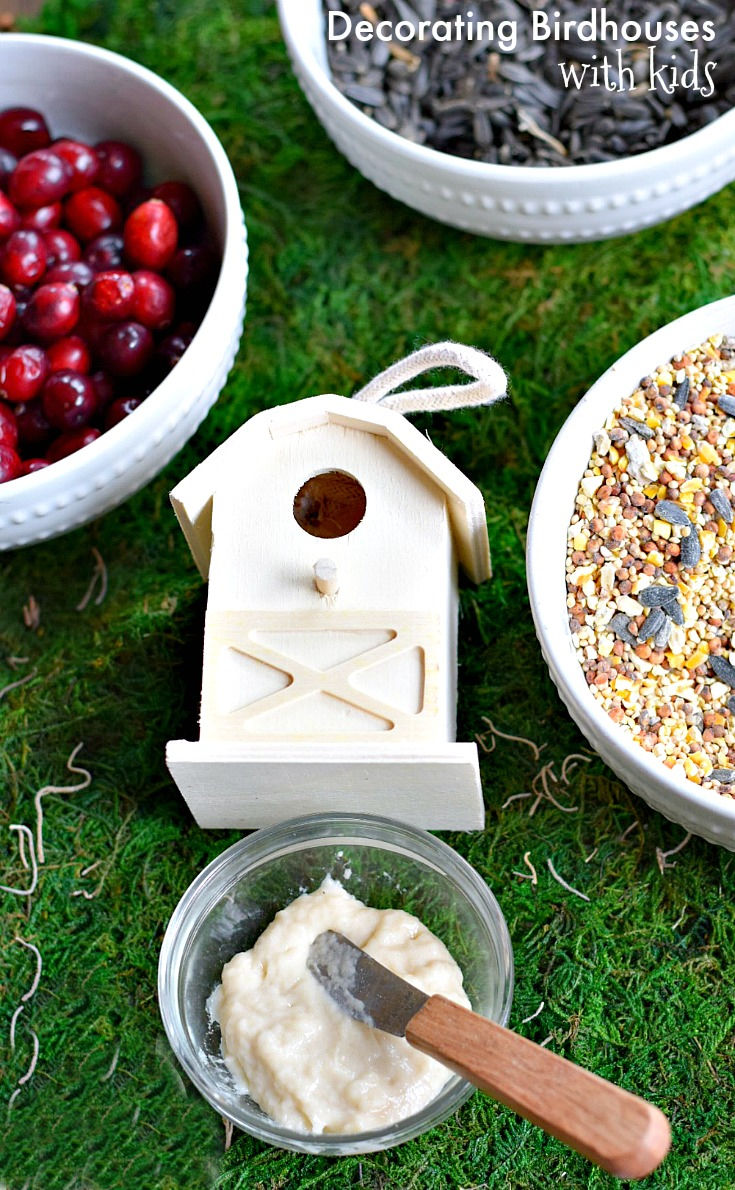 decorating birdhouses with edible glue and seeds 