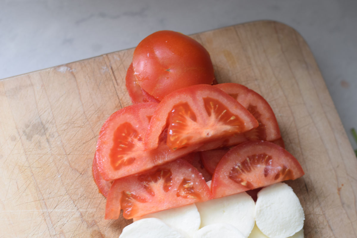 tomato slices shaped into a snowman hat 