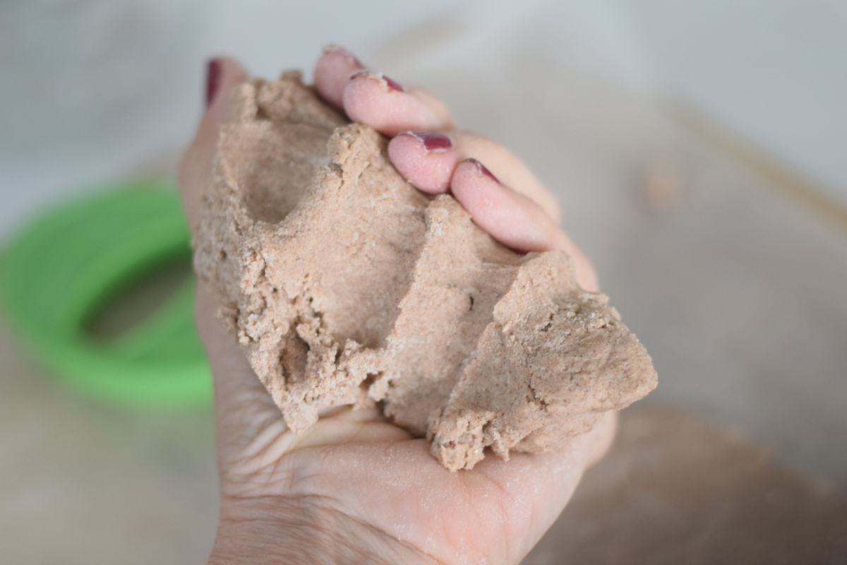 holding cinnamon salt dough 