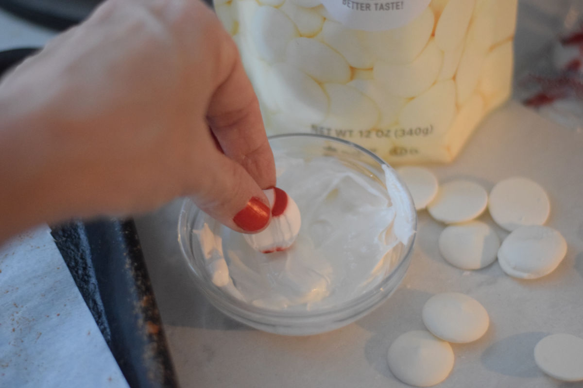 dipping peppermint candy in chocolate 